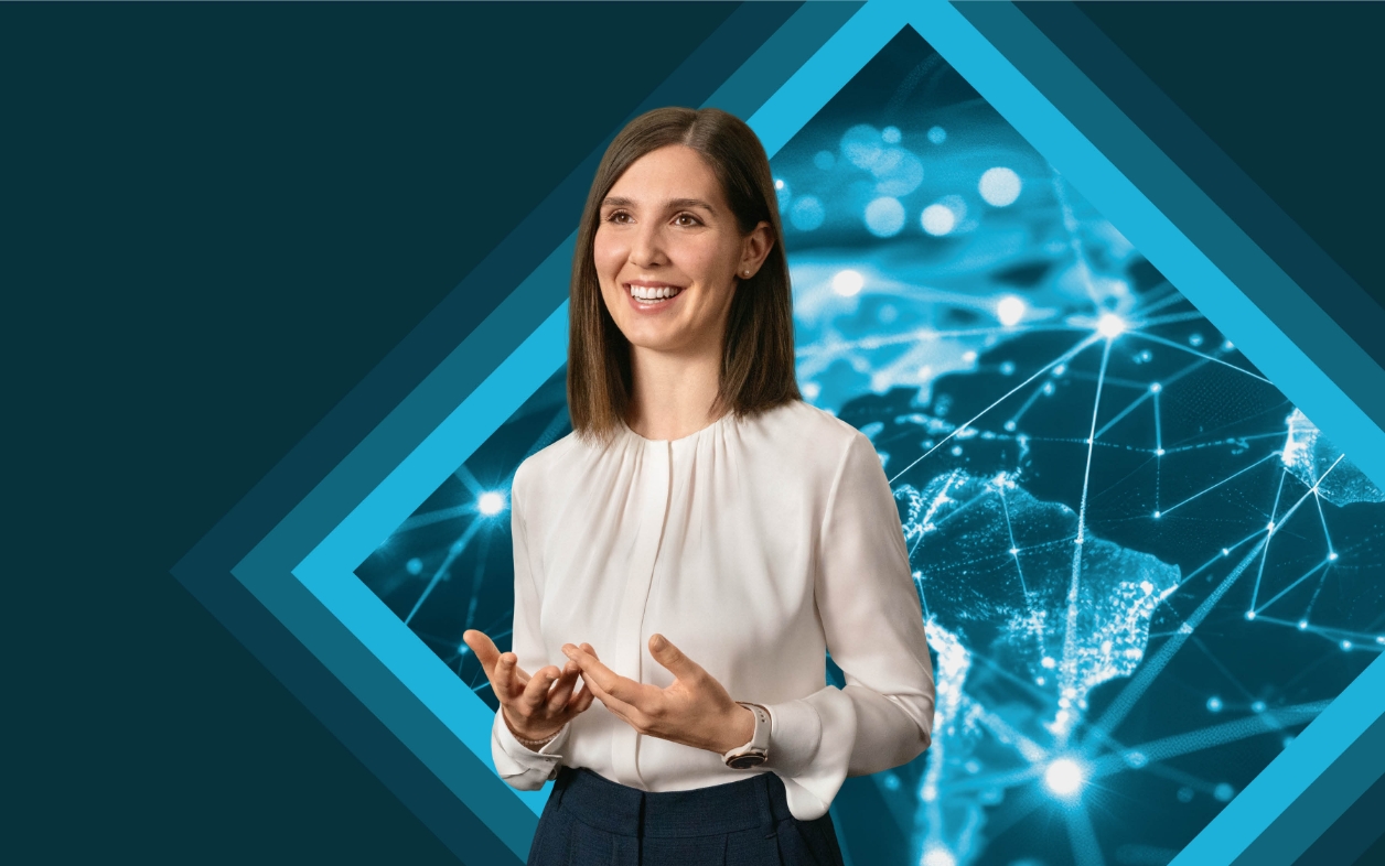 Smiling woman speaking in front of digital world map.
