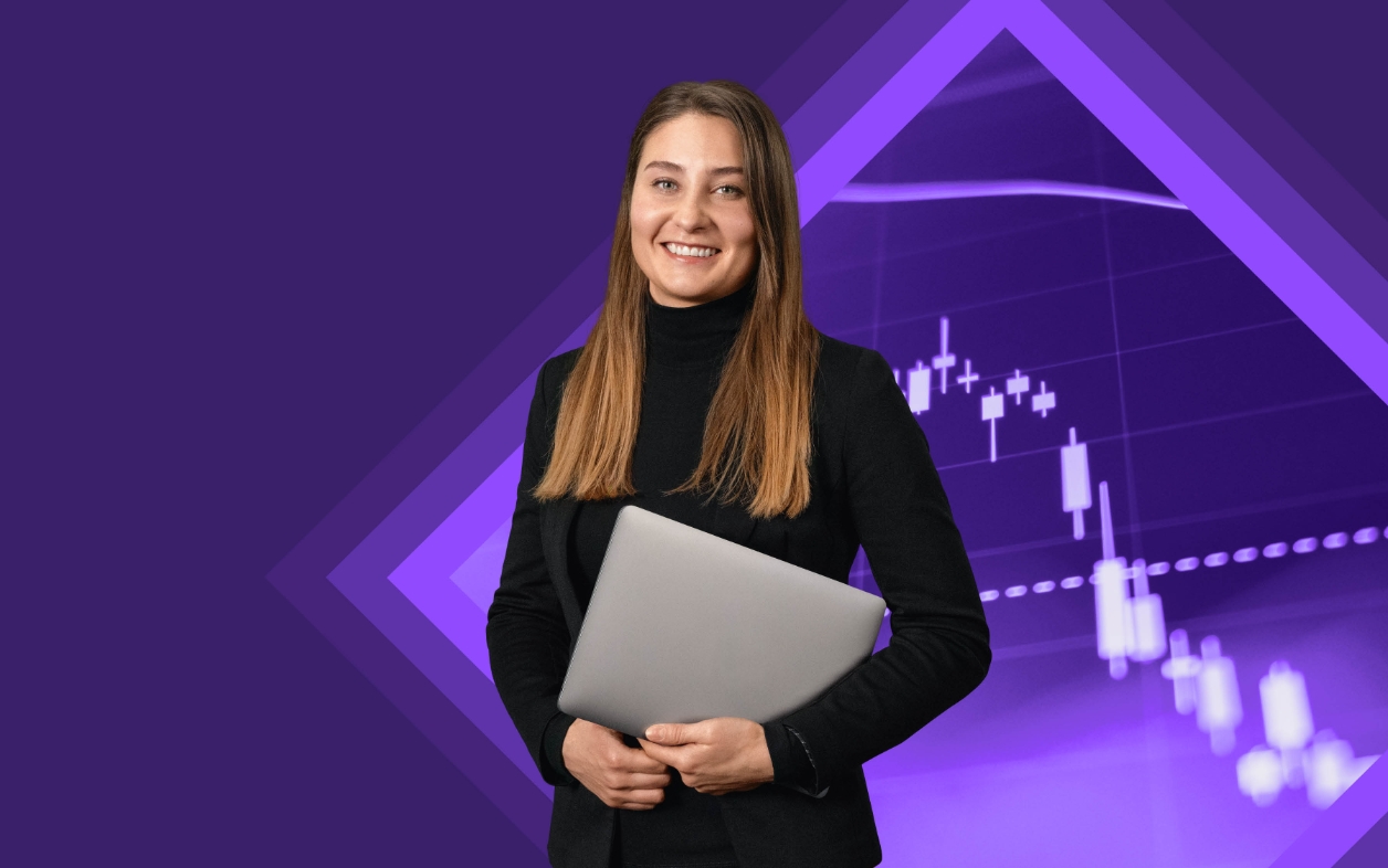 Smiling woman in black holding laptop, with stock chart background