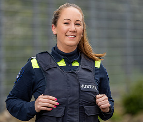Smiling female security officer outdoors