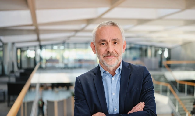 Confident senior professional in modern office