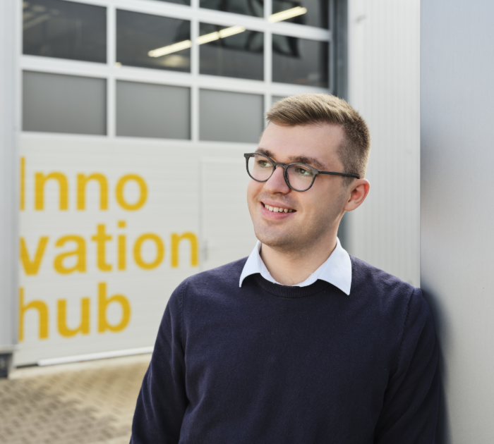 Person standing by Innovation hub entrance.