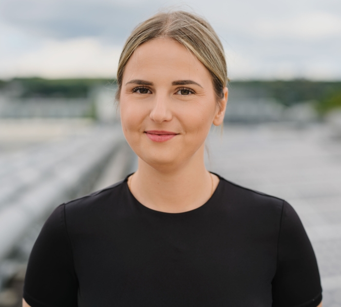 Smiling woman in a professional portrait outdoors
