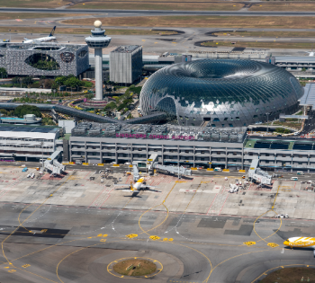 Aerial view of airport terminal with control tower