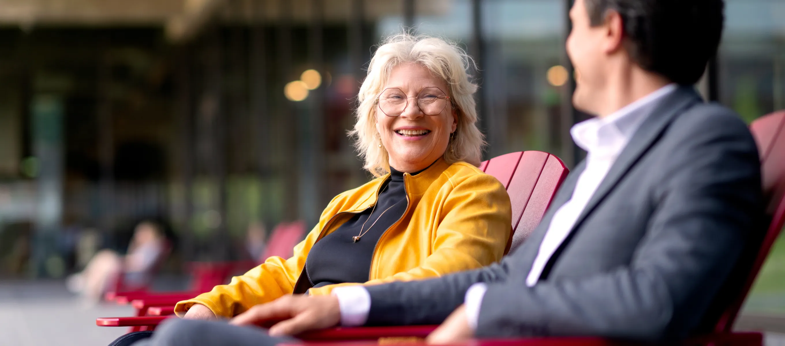 Man and woman laughing in conversation