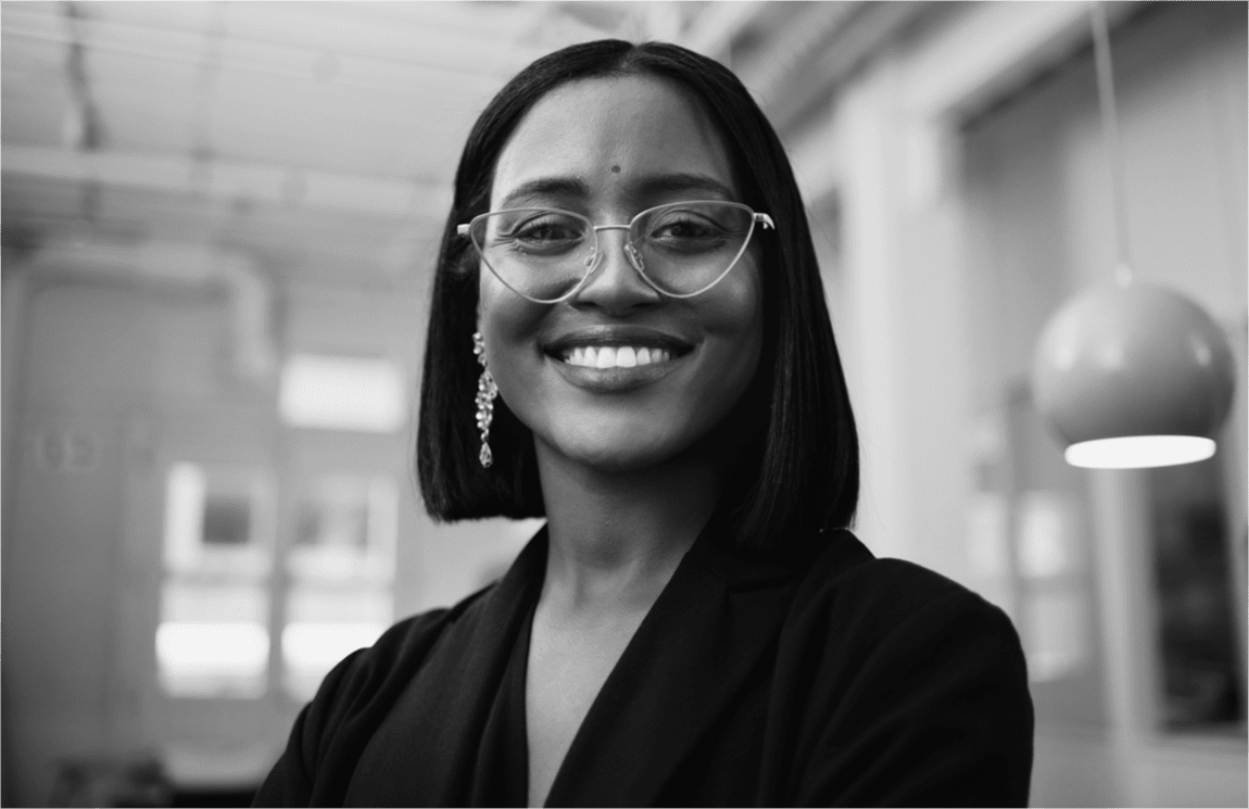 Woman smiling at camera in an office setting