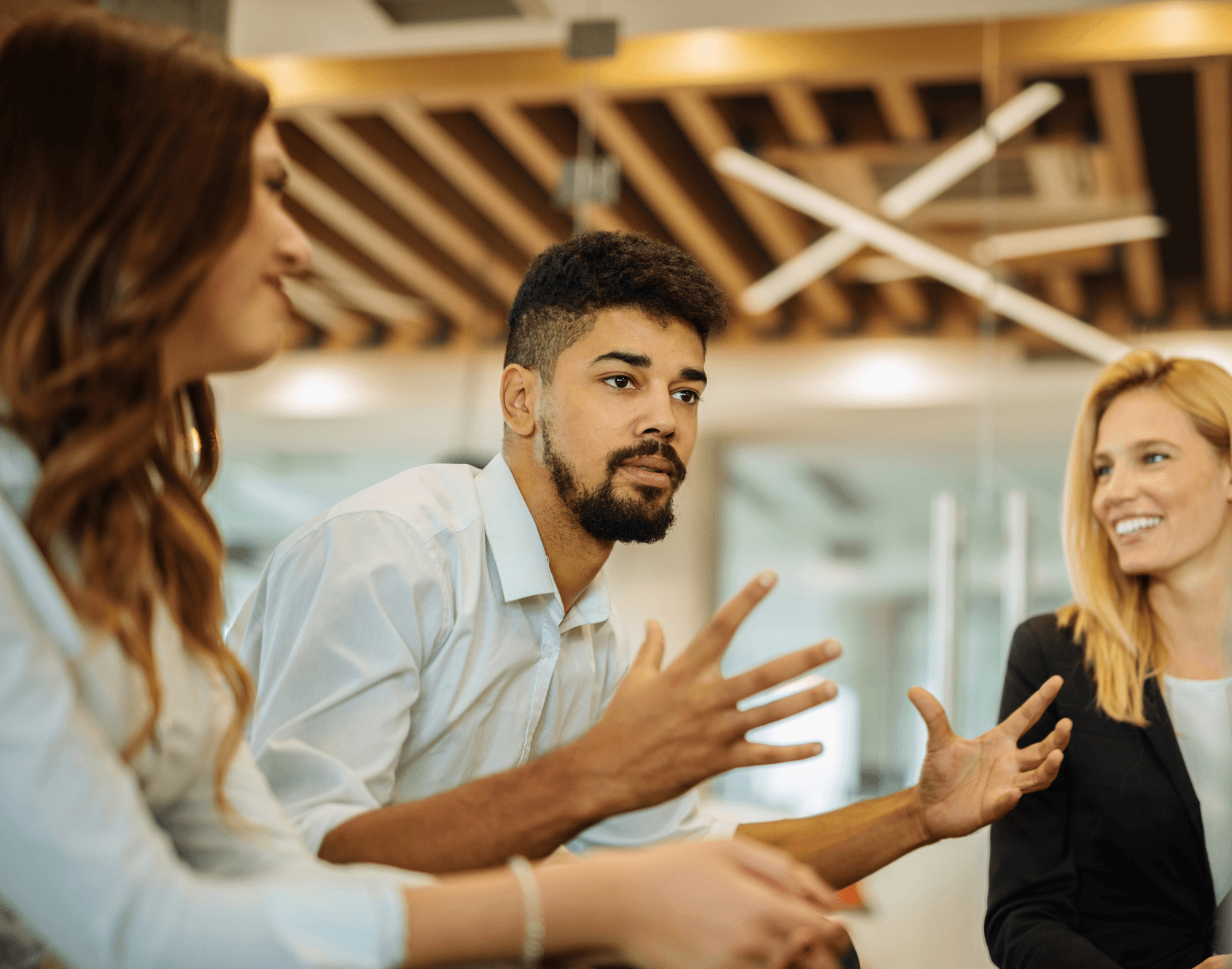 A group of professionals in a workplace setting, reflecting a collaborative work environment.