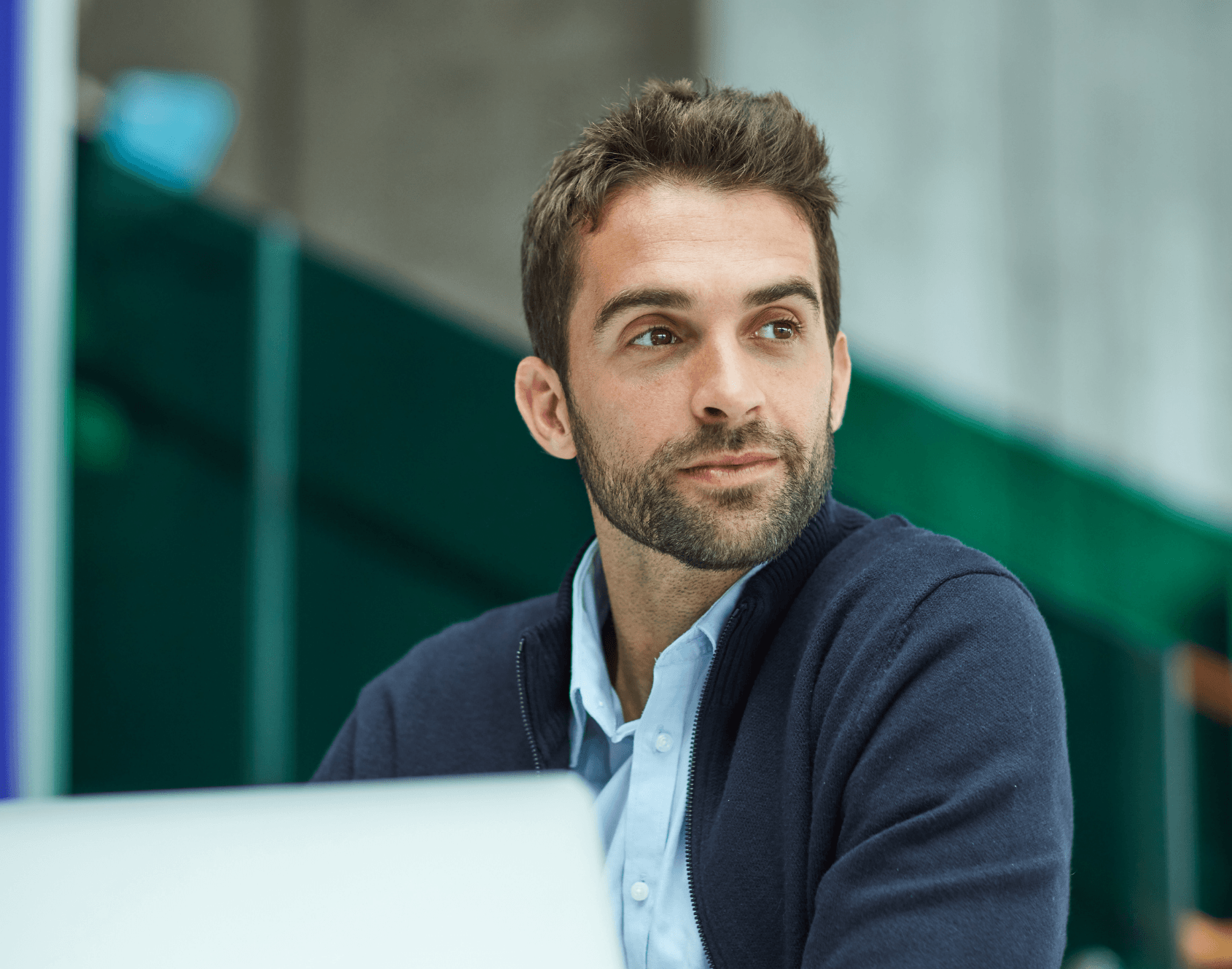 A professional working in an office setting during a typical working day.