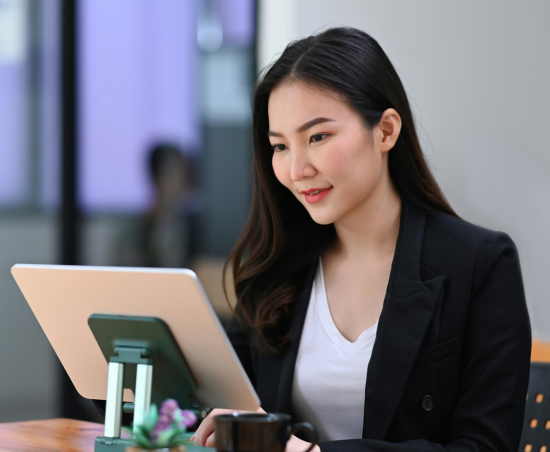 A professional working on a laptop.