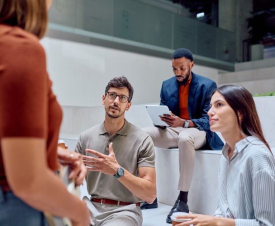 Professionals collaborating during a work discussion.
