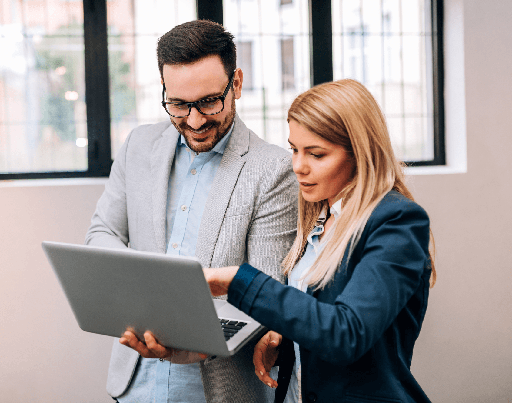 Two colleagues working together in an office setting.