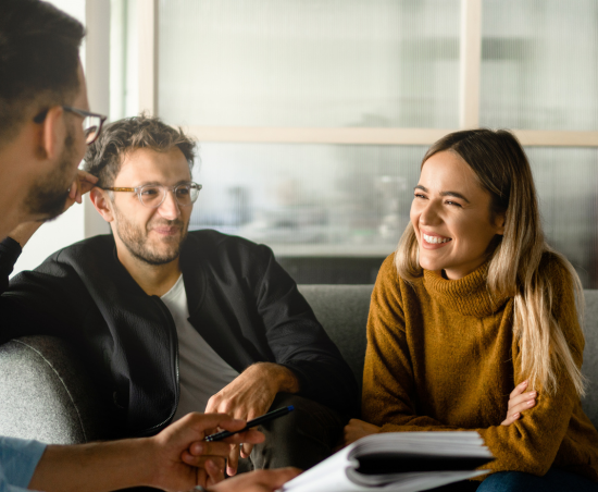 Professionals collaborating during a work discussion.
