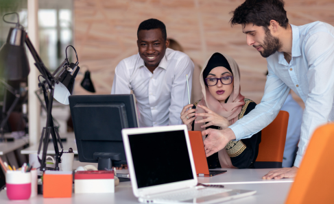 Colleagues collaborating in an office environment.