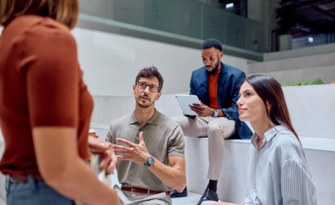 Professionals collaborating during a work discussion.