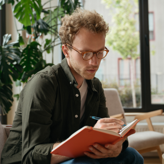 A professional working in an office setting during a typical working day.