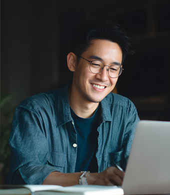 A professional working on a laptop.