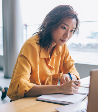 A professional working in an office setting during a typical working day.