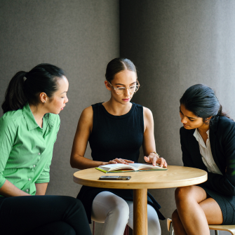 Colleagues collaborating in an office environment.