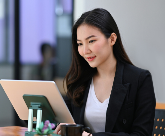 A professional working on a laptop.