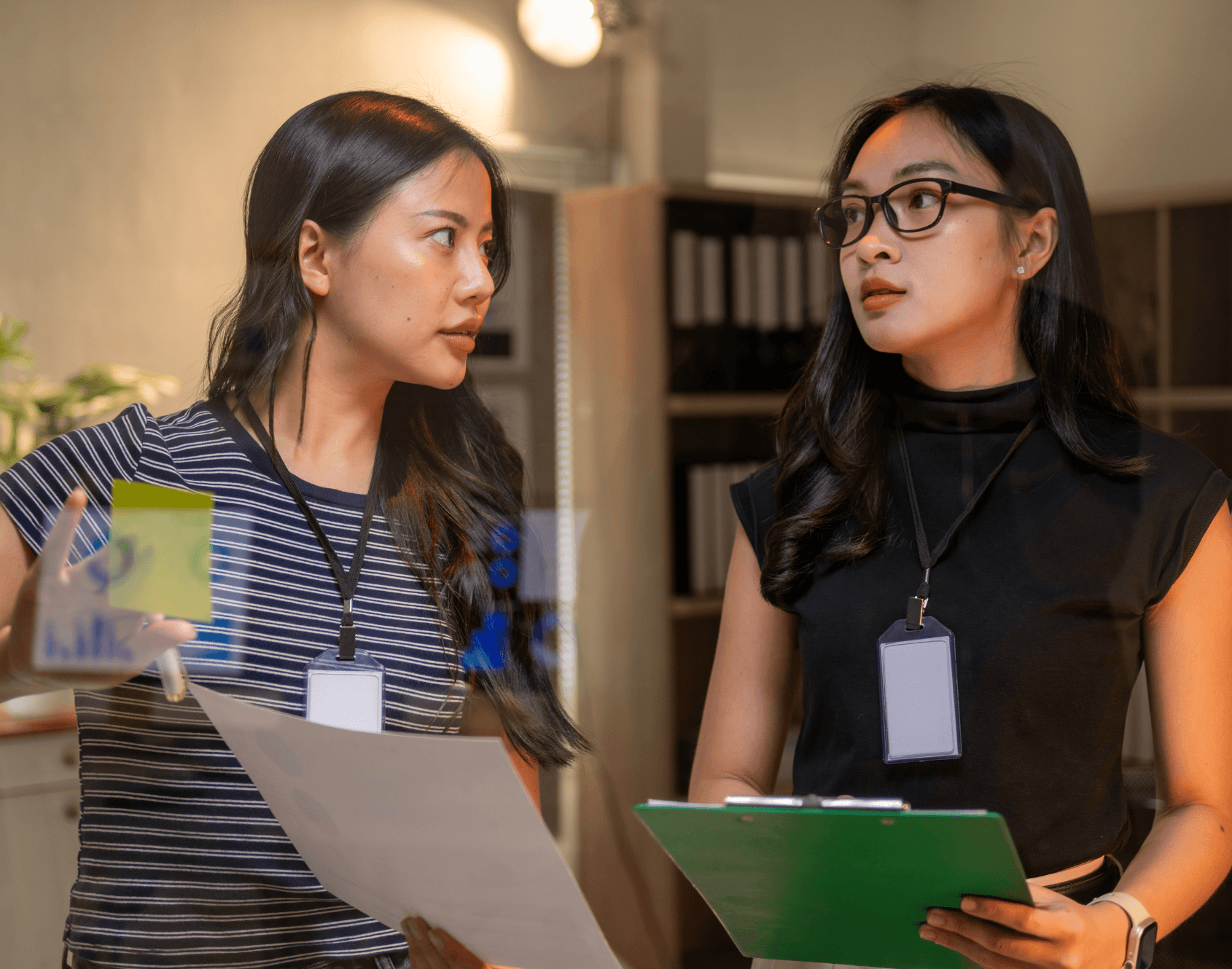 Two colleagues working together in an office setting.