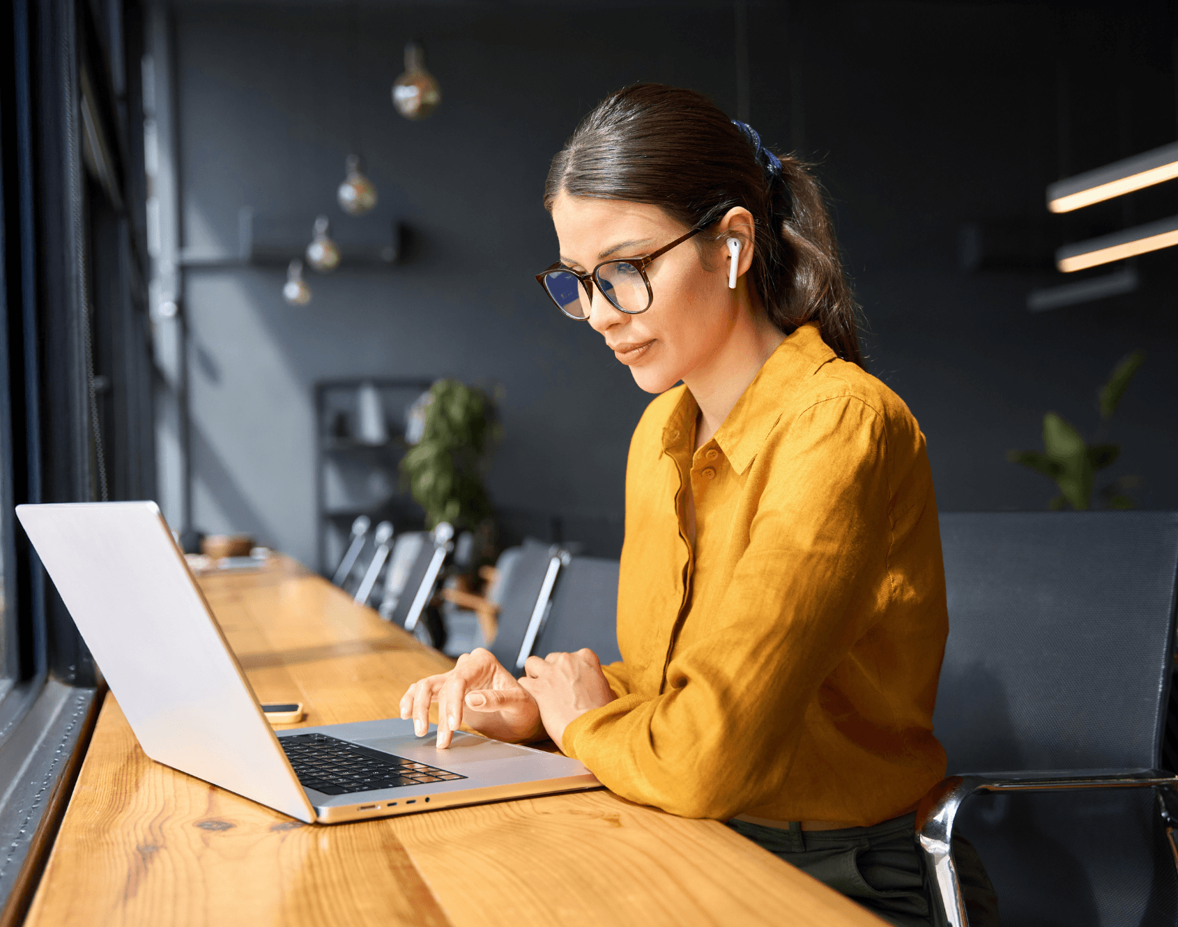 A professional working on a laptop.