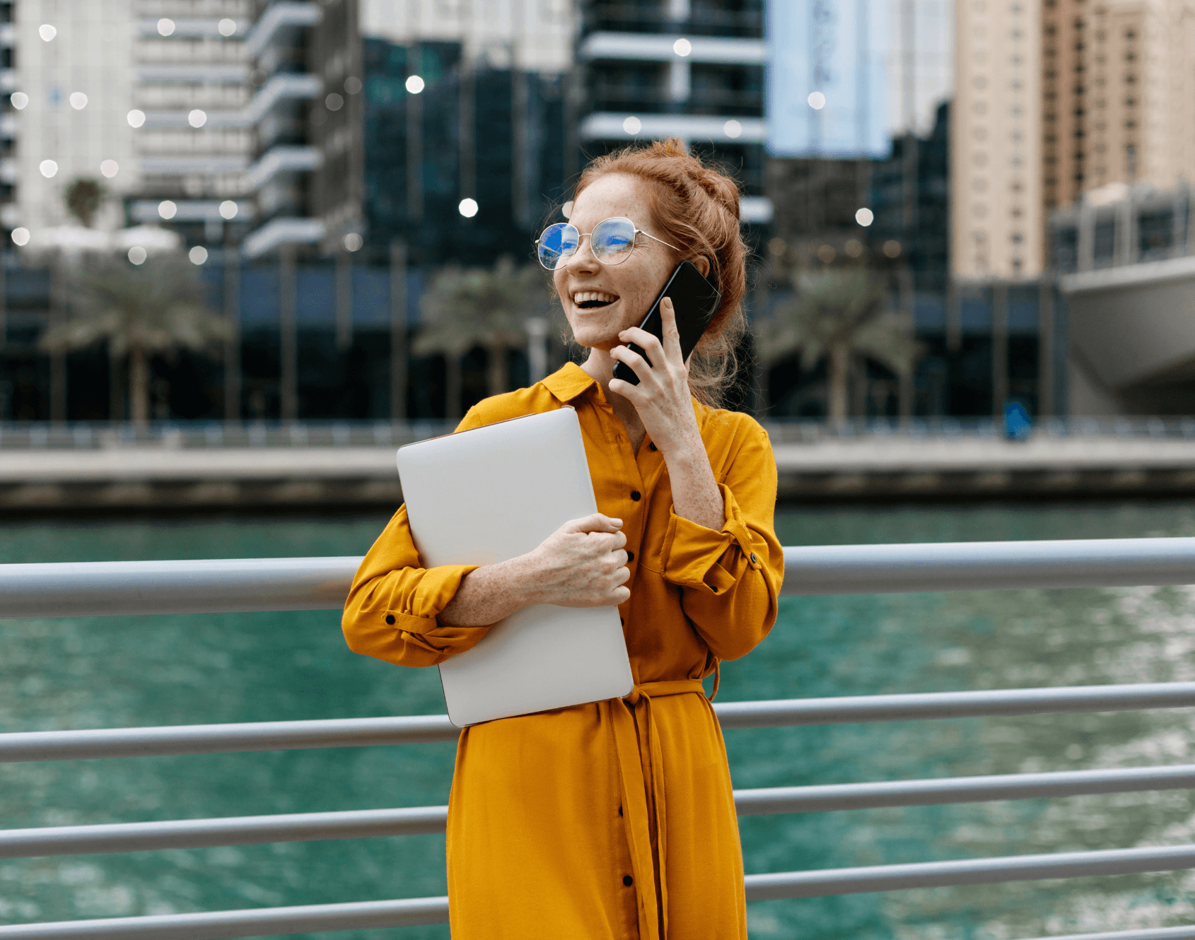 A professional smiling in a working environment.
