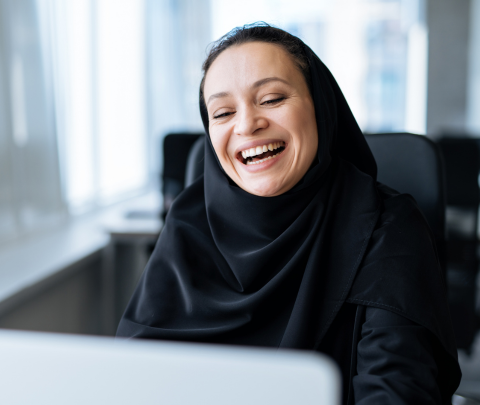 A professional working in an office setting during a typical working day.