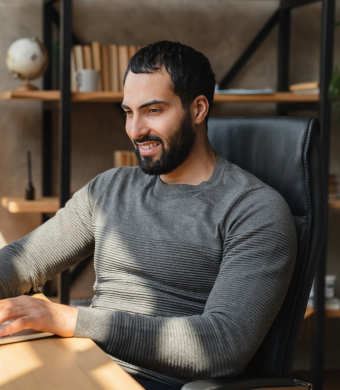 A professional working in an office setting during a typical working day.