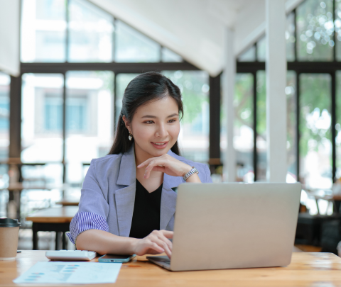 A professional working on a laptop.