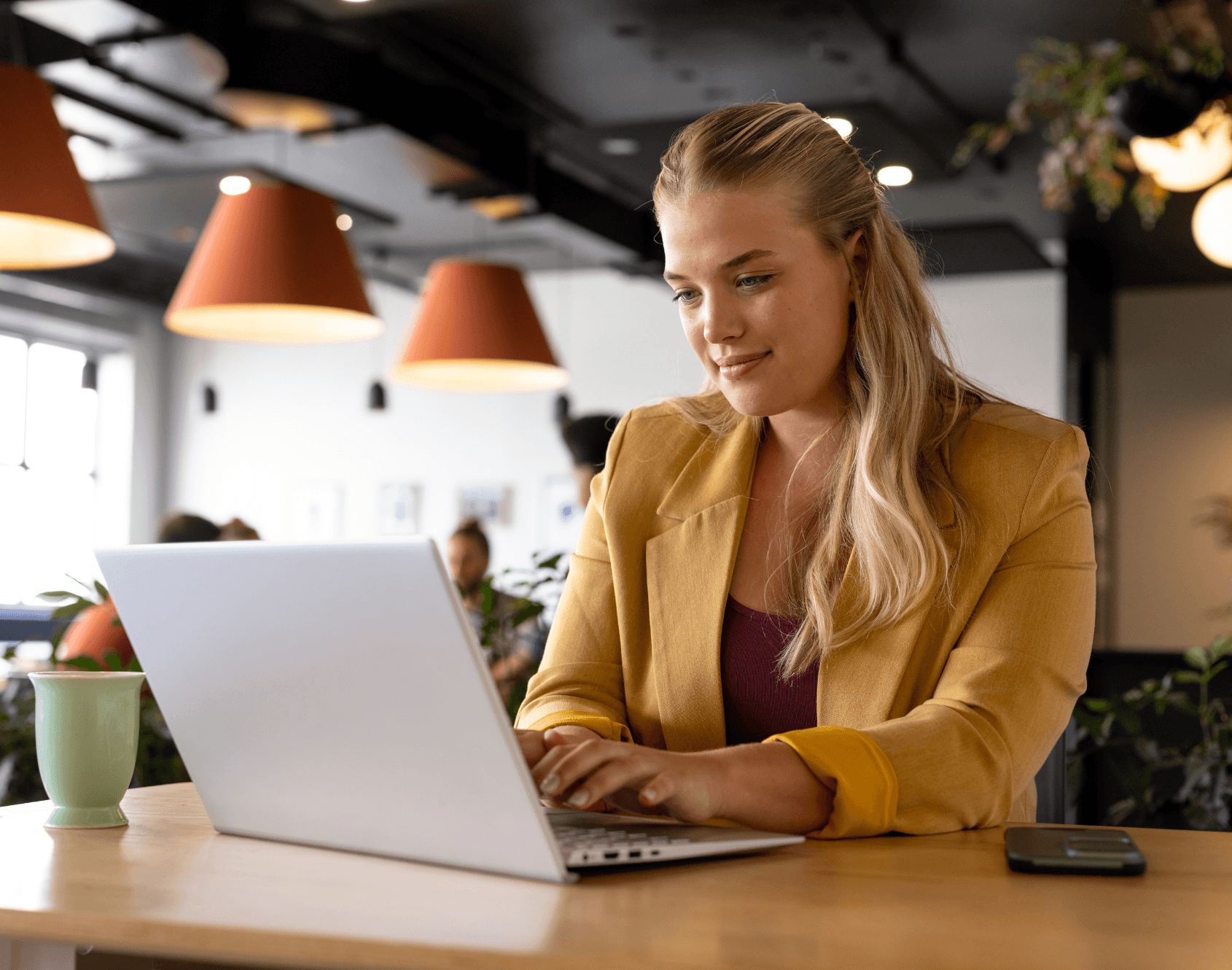 A professional working on a laptop.