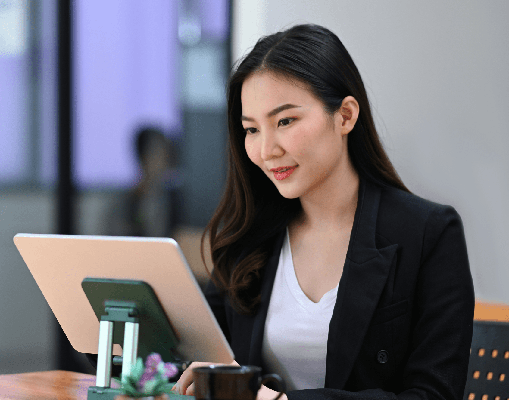 A professional working in an office setting during a typical working day.