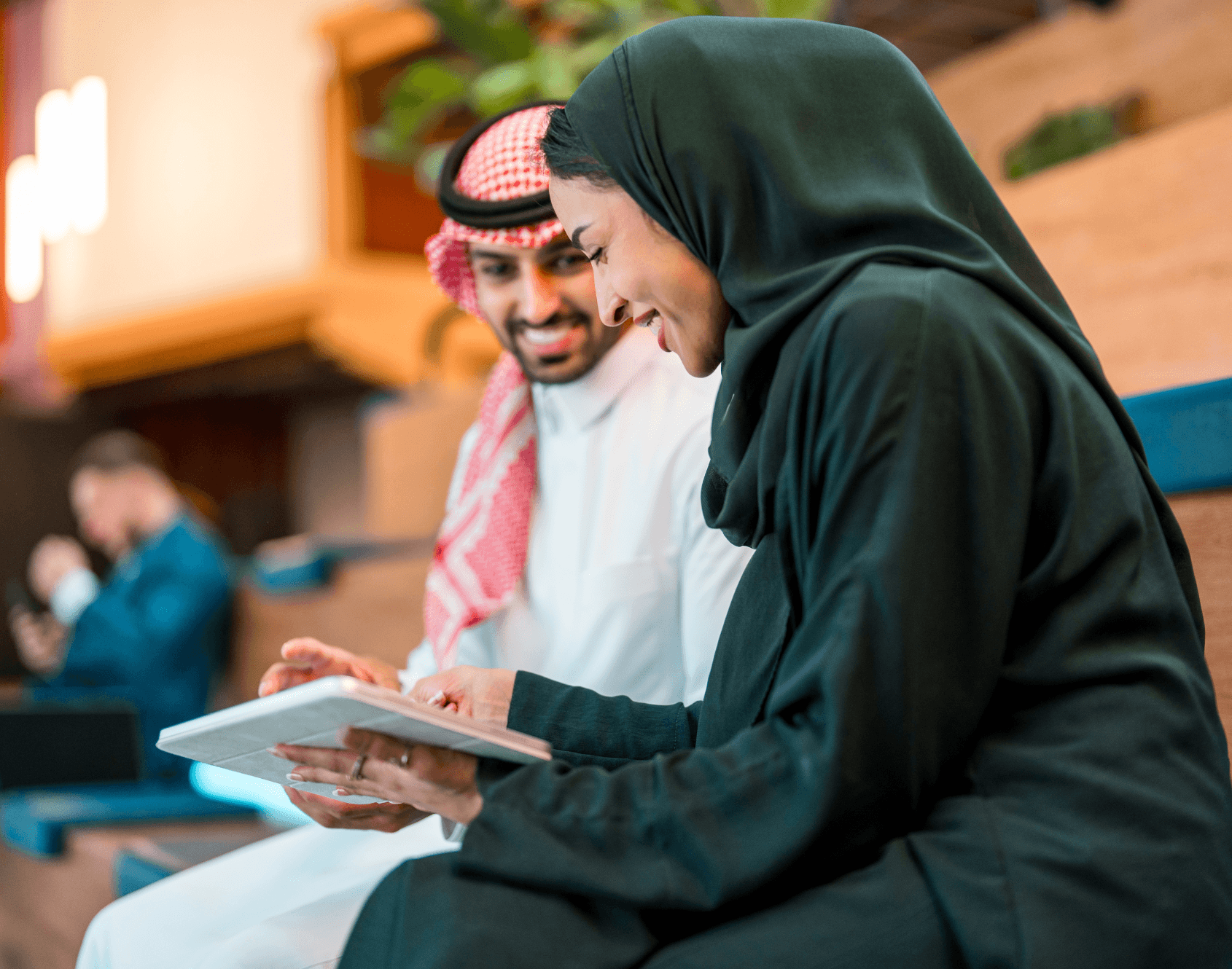 Two colleagues working together in an office setting.