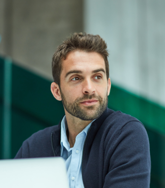 A professional working in an office setting during a typical working day.