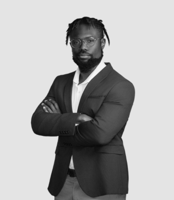 Working professional with arms crossed, facing the camera.