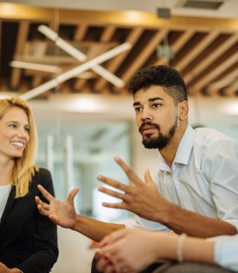 Colleagues collaborating in an office environment.