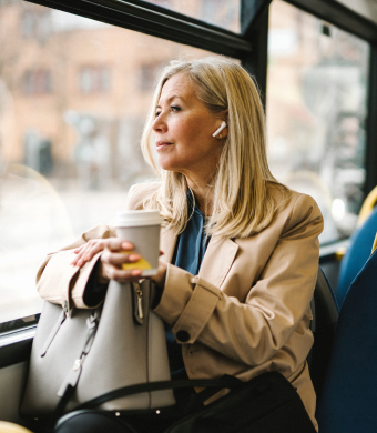 A professional seated on public transport.