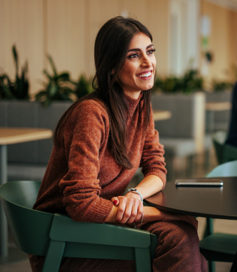 Two colleagues working together in an office setting.