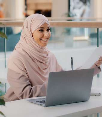 A professional working in an office setting during a typical working day.