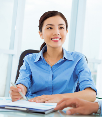 Two colleagues working together in an office setting.