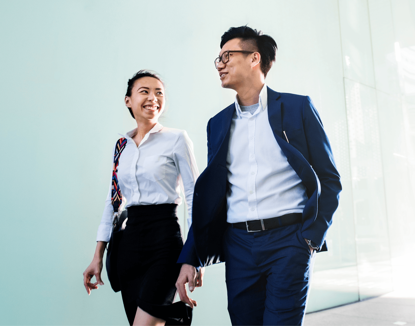 Two colleagues engaged in conversation outside of the office.