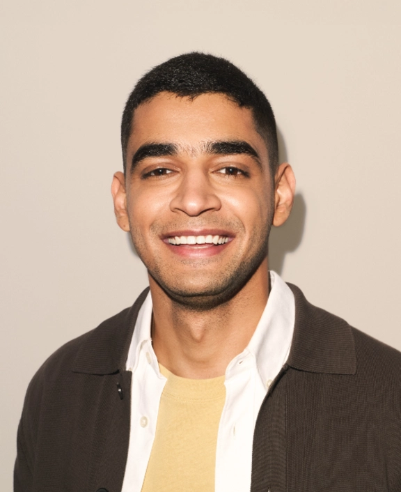 Professional portrait against a neutral background