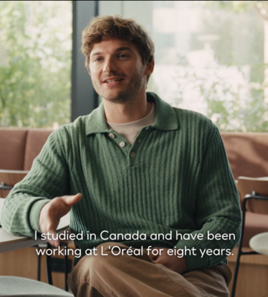 Person speaking in casual indoor interview setting