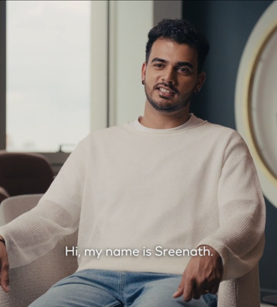 Person seated and speaking in indoor interview setting