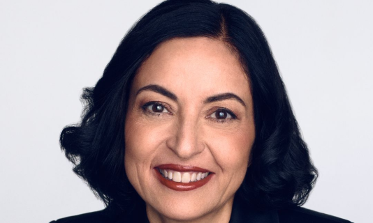 Studio portrait of professional person in dark blazer