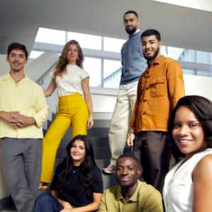 Group of people posing together on stairs