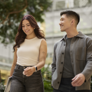 Two people walking and talking outdoors