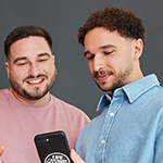 Two people looking at a phone together