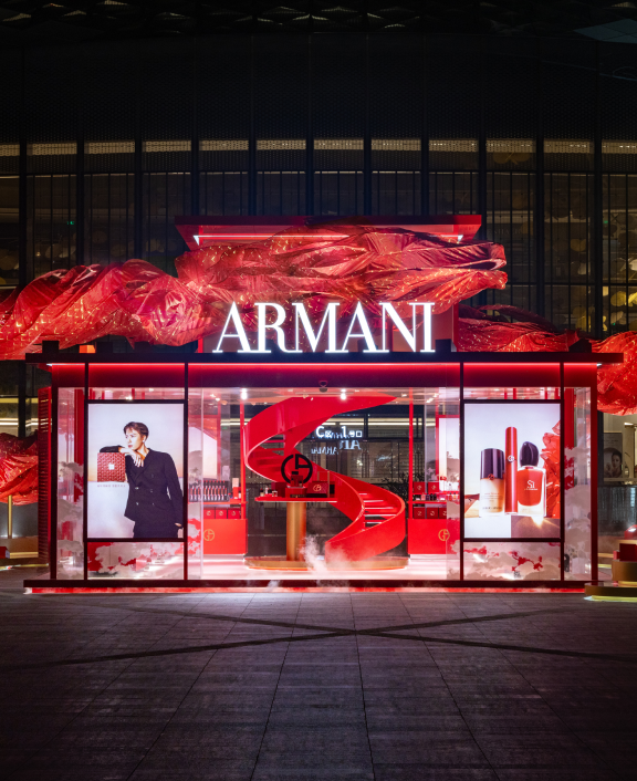 Armani store with red illuminated display at night