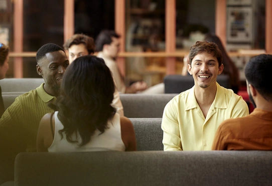 Group of people talking in a café lounge