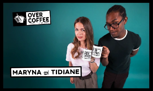 2 people posing and holding a coffee mug