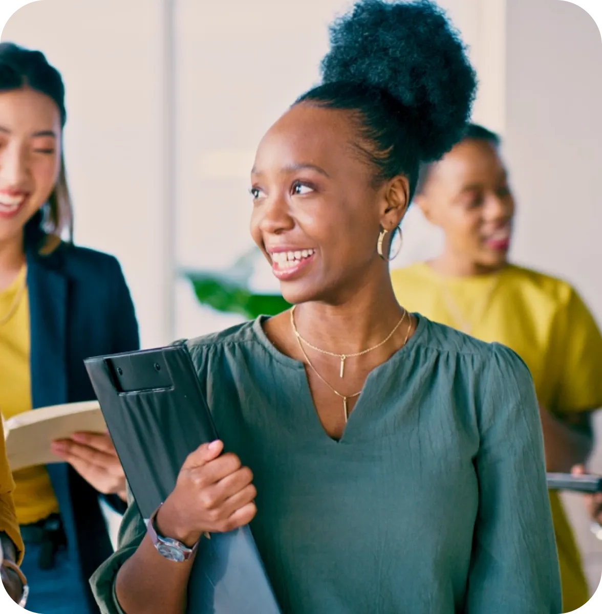 Professional team member holding tablet in office